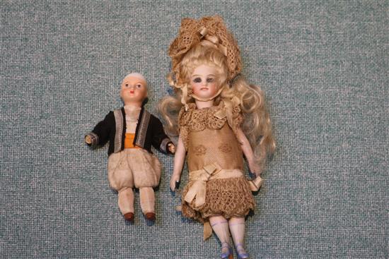 Two late 19th century bisque dolls and other small dolls